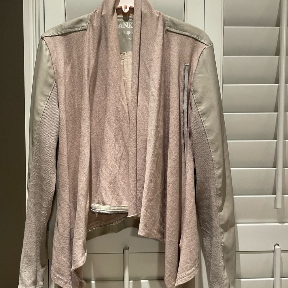 Faux leather and layered fabric jacket.